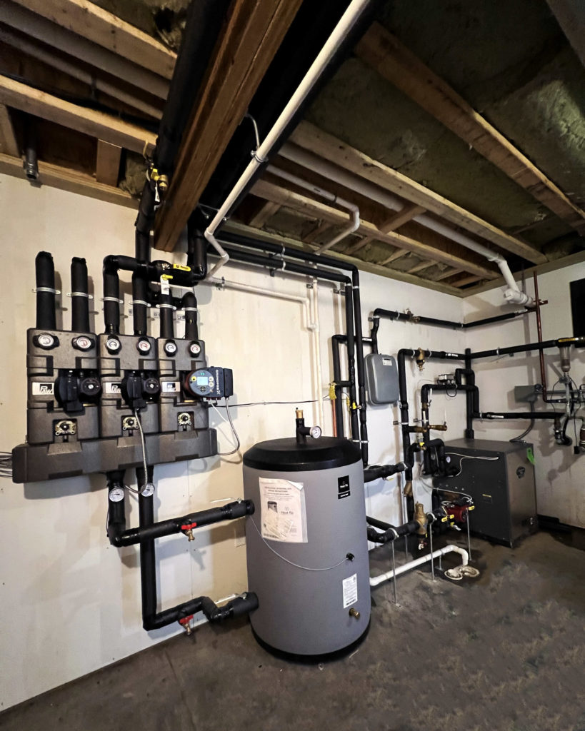 Mechanical room for a hydronic system that provides radiant cooling and heating.