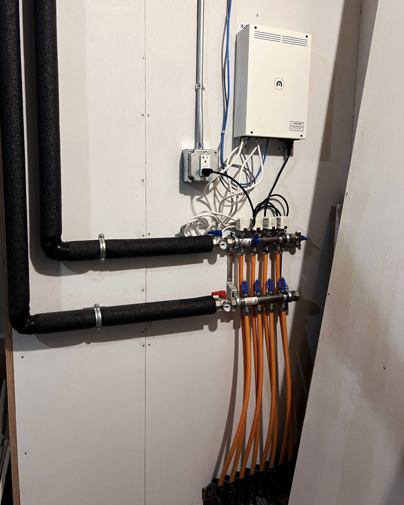 Radiant floor manifold and mZone hydronic controller.