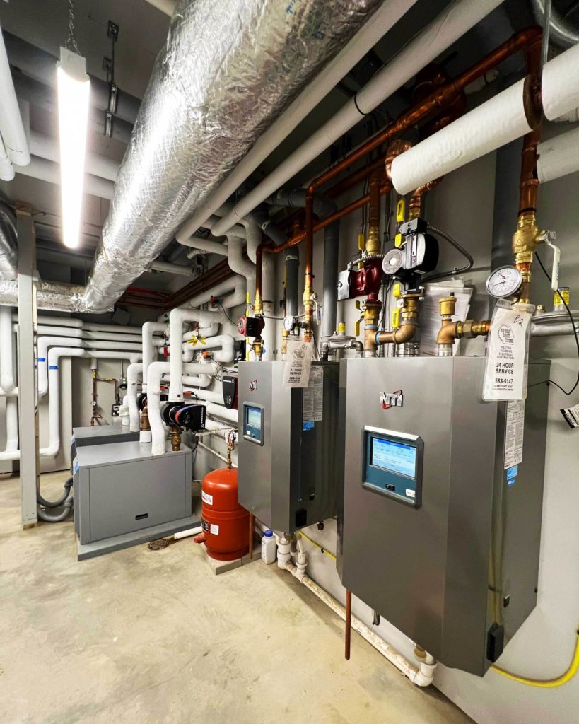 Mechanical room for four-pipe geothermal hydronic system.