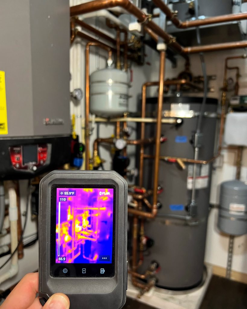 Thermal image of mechanical room for hydronic heating/cooling and DHW production.