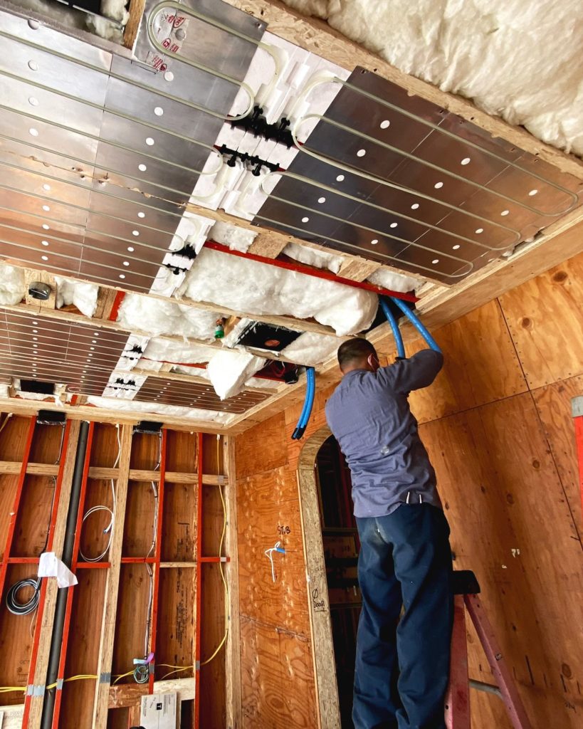 The Mayo Mechanical team installing a hydronic radiant ceiling for heating and cooling.
