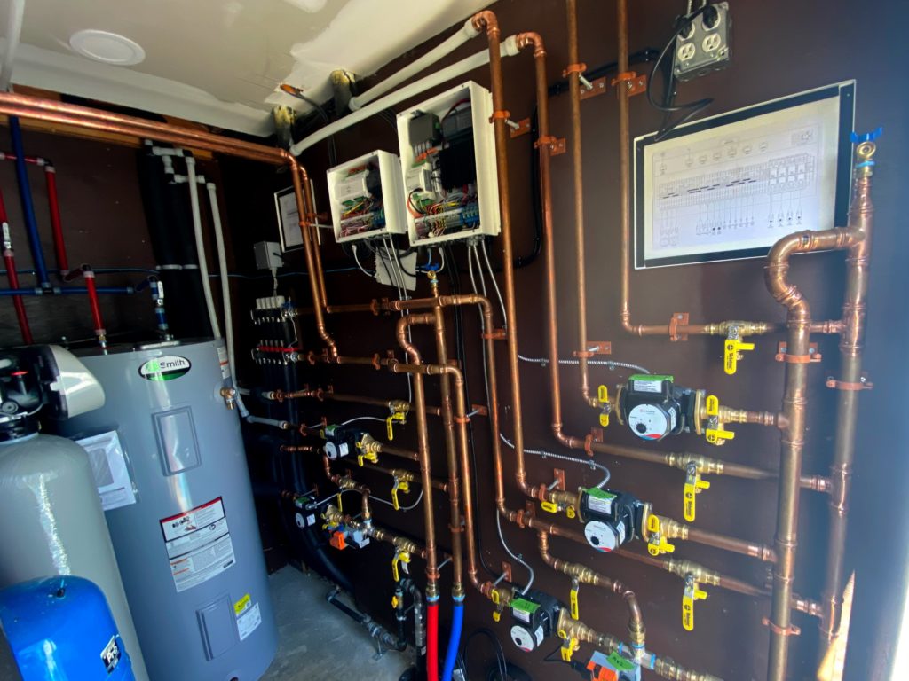 Mechanical room for a hydronic heating and cooling system.